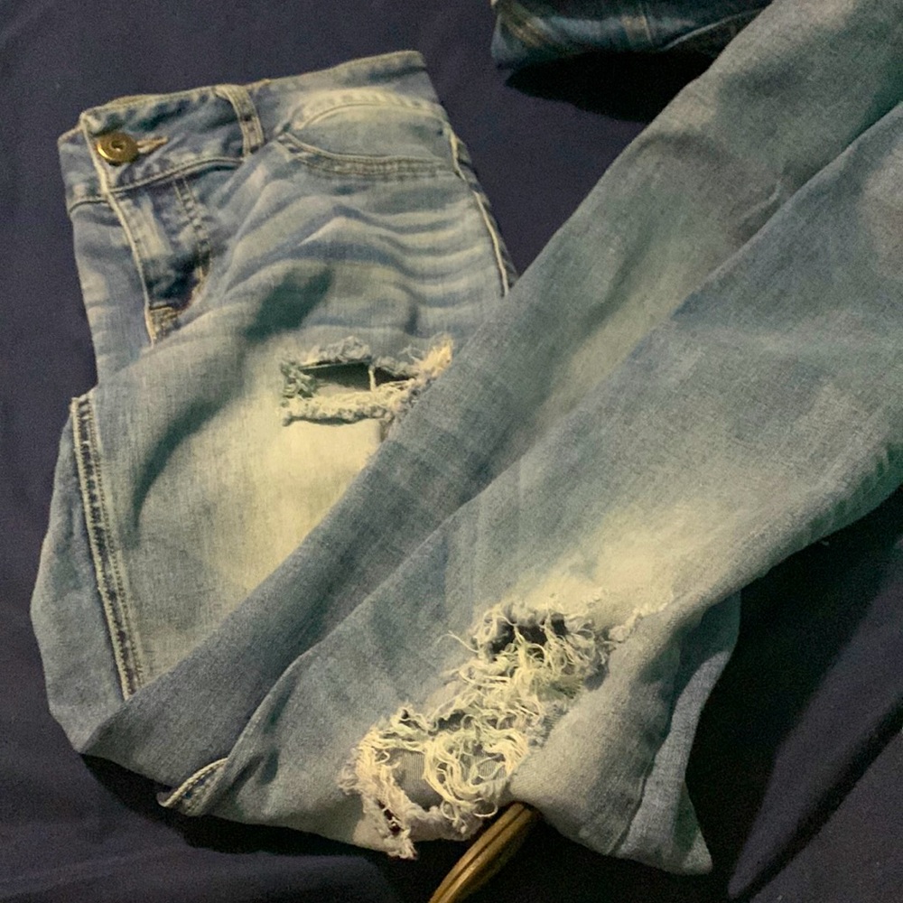 Light in color ripped jeans the rips go into the upper thighs